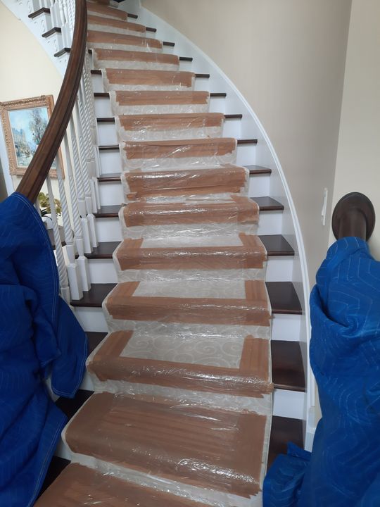 Staircase protected with runners and padded banister (Full Service Moving) by Affordable Moving Solutions of Ohio