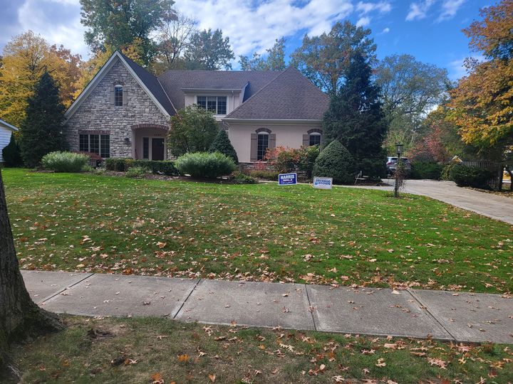 Stone cottage home with a front lawn (Onsite Moving Services) by Affordable Moving Solutions of Ohio